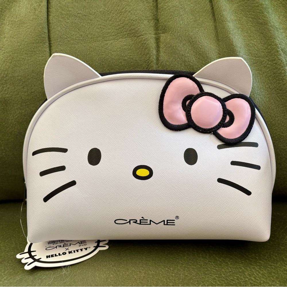 NEW Crème Hello Kitty Cosmetic Pouch by Sanrio. White /pink bow. NEW w/tags